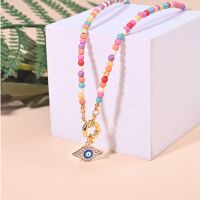 Kette Choker Perlen pastell/goldfarben Evil Eye Messing...